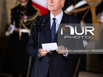 In Paris, France, on December 13, 2024, Michel Barnier, the resigning Prime Minister, speaks during the handover ceremony between himself, t...