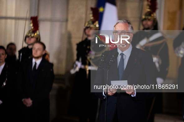 In Paris, France, on December 13, 2024, Michel Barnier, the resigning Prime Minister, speaks during the handover ceremony between himself, t...