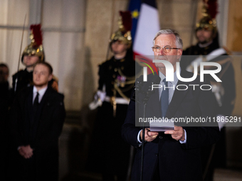 In Paris, France, on December 13, 2024, Michel Barnier, the resigning Prime Minister, speaks during the handover ceremony between himself, t...