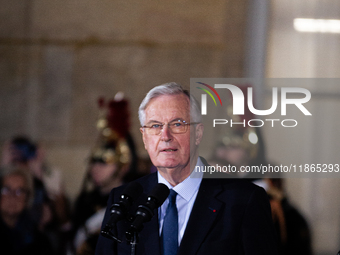 In Paris, France, on December 13, 2024, Michel Barnier, the resigning Prime Minister, speaks during the handover ceremony between himself, t...