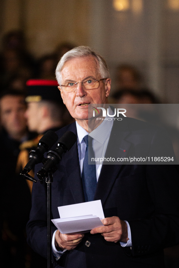 In Paris, France, on December 13, 2024, Michel Barnier, the resigning Prime Minister, speaks during the handover ceremony between himself, t...