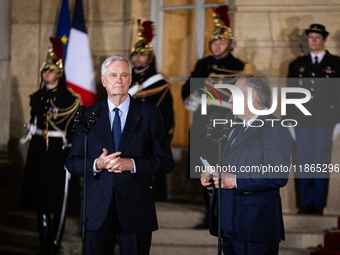 Michel Barnier, the resigning prime minister, and Francois Bayrou, are seen during the speech of the handover ceremony between Michel Barnie...