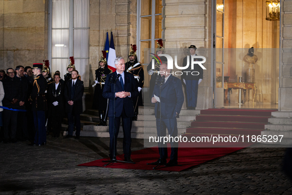 Michel Barnier, the resigning prime minister, and Francois Bayrou, are seen during the speech of the handover ceremony between Michel Barnie...