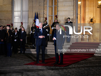 Michel Barnier, the resigning prime minister, and Francois Bayrou, are seen during the speech of the handover ceremony between Michel Barnie...