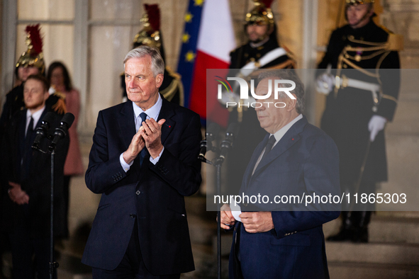 Michel Barnier, the resigning prime minister, and Francois Bayrou, are seen during the speech of the handover ceremony between Michel Barnie...