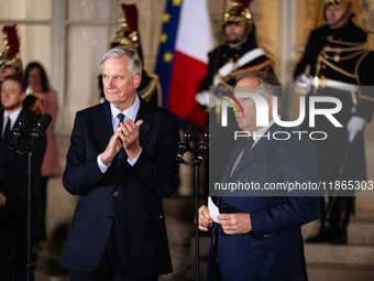 Michel Barnier, the resigning prime minister, and Francois Bayrou, are seen during the speech of the handover ceremony between Michel Barnie...