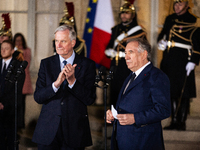 Michel Barnier, the resigning prime minister, and Francois Bayrou, are seen during the speech of the handover ceremony between Michel Barnie...