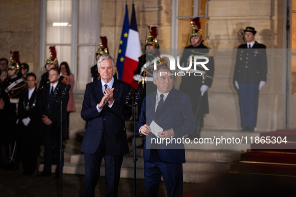 Michel Barnier, the resigning prime minister, and Francois Bayrou, are seen during the speech of the handover ceremony between Michel Barnie...