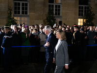 Michel Barnier, the resigning Prime Minister, departs at the end of the handover ceremony with his wife Isabelle Altmayer during the ceremon...