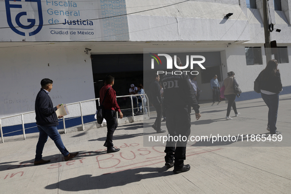 Activists sign documents to receive dogs that are rescued from a shelter in Mexico City, Mexico, on December 13, 2024, after 17 days of unce...