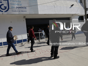 Activists sign documents to receive dogs that are rescued from a shelter in Mexico City, Mexico, on December 13, 2024, after 17 days of unce...