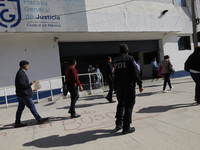 Activists sign documents to receive dogs that are rescued from a shelter in Mexico City, Mexico, on December 13, 2024, after 17 days of unce...