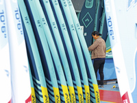 A worker produces surfboards for export to Europe and the United States at a production workshop in Suqian, Jiangsu province, China, on Dece...