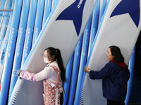 Workers produce surfboards for export to Europe and the United States at a production workshop in Suqian, Jiangsu province, China, on Decemb...