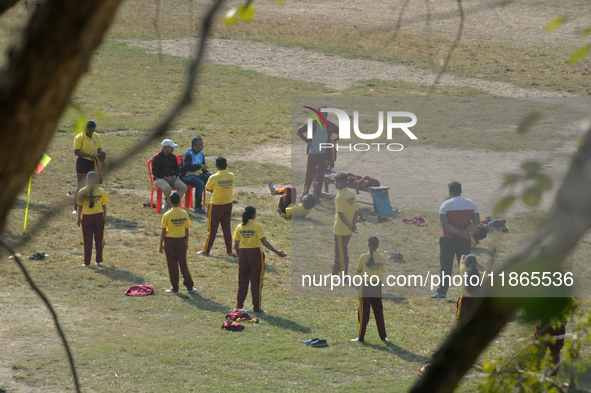 Indian school children practice their school drill at a ground in Siliguri, India, on December 14, 2024. 