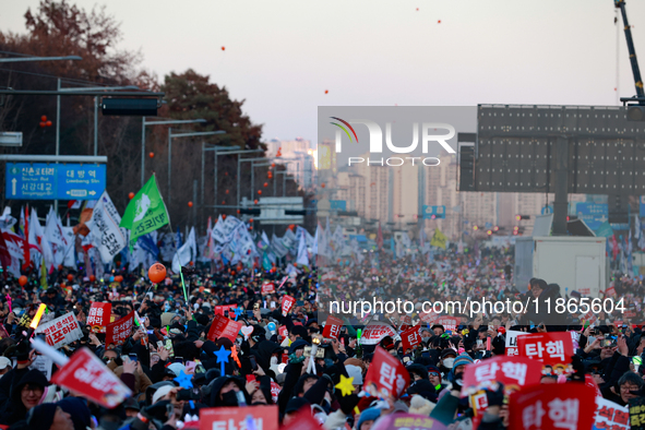 Citizens cheer after the impeachment of President Yoon Suk-yeol is passed in Seoul, South Korea, on December 14, 2024. Approximately 2 milli...