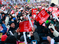 Citizens cheer after the impeachment of President Yoon Suk-yeol is passed in Seoul, South Korea, on December 14, 2024. Approximately 2 milli...