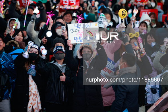 Citizens cheer after the impeachment of President Yoon Suk-yeol is passed in Seoul, South Korea, on December 14, 2024. Approximately 2 milli...