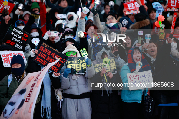 Citizens cheer after the impeachment of President Yoon Suk-yeol is passed in Seoul, South Korea, on December 14, 2024. Approximately 2 milli...