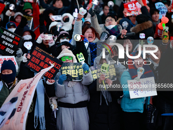 Citizens cheer after the impeachment of President Yoon Suk-yeol is passed in Seoul, South Korea, on December 14, 2024. Approximately 2 milli...