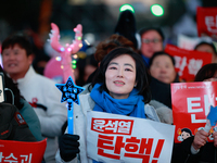 Citizens cheer after the impeachment of President Yoon Suk-yeol is passed in Seoul, South Korea, on December 14, 2024. Approximately 2 milli...