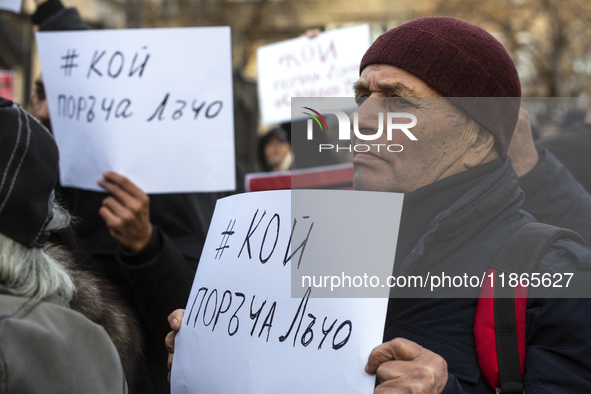 Representatives of the parliamentary party We Continue the Change stand in front of the Sofia City Court in Sofia, Bulgaria, on December 14,...