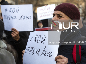 Representatives of the parliamentary party We Continue the Change stand in front of the Sofia City Court in Sofia, Bulgaria, on December 14,...