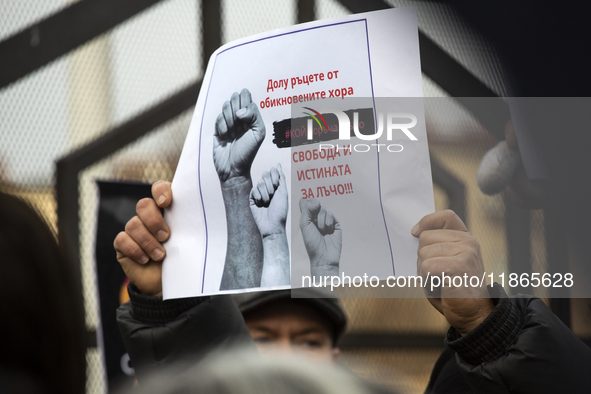 Representatives of the parliamentary party We Continue the Change stand in front of the Sofia City Court in Sofia, Bulgaria, on December 14,...