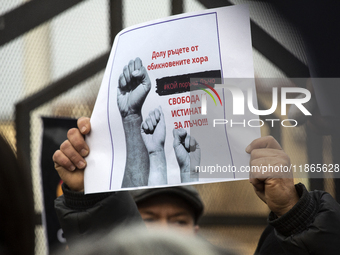 Representatives of the parliamentary party We Continue the Change stand in front of the Sofia City Court in Sofia, Bulgaria, on December 14,...