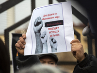 Representatives of the parliamentary party We Continue the Change stand in front of the Sofia City Court in Sofia, Bulgaria, on December 14,...