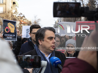 Asen Vasilev, co-leader of the political party We Continue the Change, stands in front of the Sofia City Court in Sofia, Bulgaria, on Decemb...