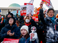 Citizens cheer after the impeachment of President Yoon Suk-yeol is passed in Seoul, South Korea, on December 14, 2024. Approximately 2 milli...