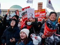 Citizens cheer after the impeachment of President Yoon Suk-yeol is passed in Seoul, South Korea, on December 14, 2024. Approximately 2 milli...