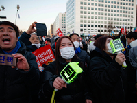 Citizens cheer after the impeachment of President Yoon Suk-yeol is passed in Seoul, South Korea, on December 14, 2024. Approximately 2 milli...