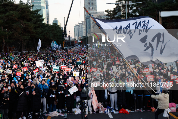 Citizens cheer after the impeachment of President Yoon Suk-yeol is passed in Seoul, South Korea, on December 14, 2024. Approximately 2 milli...