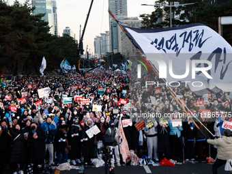 Citizens cheer after the impeachment of President Yoon Suk-yeol is passed in Seoul, South Korea, on December 14, 2024. Approximately 2 milli...