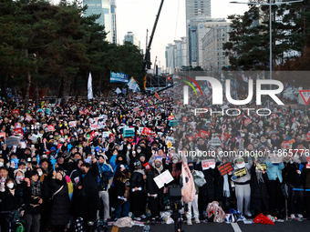 Citizens cheer after the impeachment of President Yoon Suk-yeol is passed in Seoul, South Korea, on December 14, 2024. Approximately 2 milli...