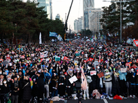 Citizens cheer after the impeachment of President Yoon Suk-yeol is passed in Seoul, South Korea, on December 14, 2024. Approximately 2 milli...