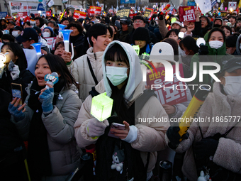 Citizens cheer after the impeachment of President Yoon Suk-yeol is passed in Seoul, South Korea, on December 14, 2024. Approximately 2 milli...