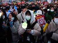 Citizens cheer after the impeachment of President Yoon Suk-yeol is passed in Seoul, South Korea, on December 14, 2024. Approximately 2 milli...