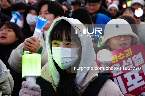 Citizens cheer after the impeachment of President Yoon Suk-yeol is passed in Seoul, South Korea, on December 14, 2024. Approximately 2 milli...