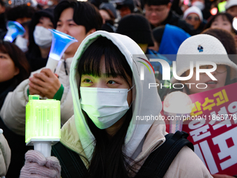 Citizens cheer after the impeachment of President Yoon Suk-yeol is passed in Seoul, South Korea, on December 14, 2024. Approximately 2 milli...