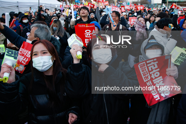 Citizens cheer after the impeachment of President Yoon Suk-yeol is passed in Seoul, South Korea, on December 14, 2024. Approximately 2 milli...