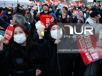 Citizens cheer after the impeachment of President Yoon Suk-yeol is passed in Seoul, South Korea, on December 14, 2024. Approximately 2 milli...