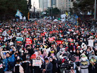 Citizens cheer after the impeachment of President Yoon Suk-yeol is passed in Seoul, South Korea, on December 14, 2024. Approximately 2 milli...