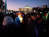 Citizens cheer after the impeachment of President Yoon Suk-yeol is passed in Seoul, South Korea, on December 14, 2024. Approximately 2 milli...