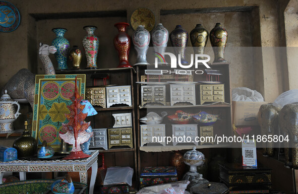 In Srinagar, Kashmir, India, on December 14, 2024, Christmas ornaments of Santa Claus are ready at the workshop before being sent to the mar...