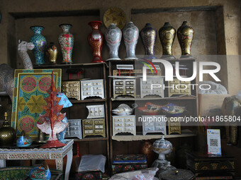 In Srinagar, Kashmir, India, on December 14, 2024, Christmas ornaments of Santa Claus are ready at the workshop before being sent to the mar...