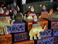 In Srinagar, Kashmir, India, on December 14, 2024, Christmas ornaments of Santa Claus are ready at the workshop before being sent to the mar...