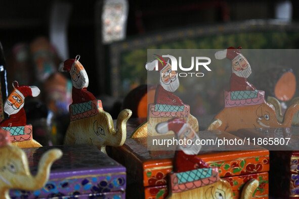 In Srinagar, Kashmir, India, on December 14, 2024, Christmas ornaments of Santa Claus are ready at the workshop before being sent to the mar...